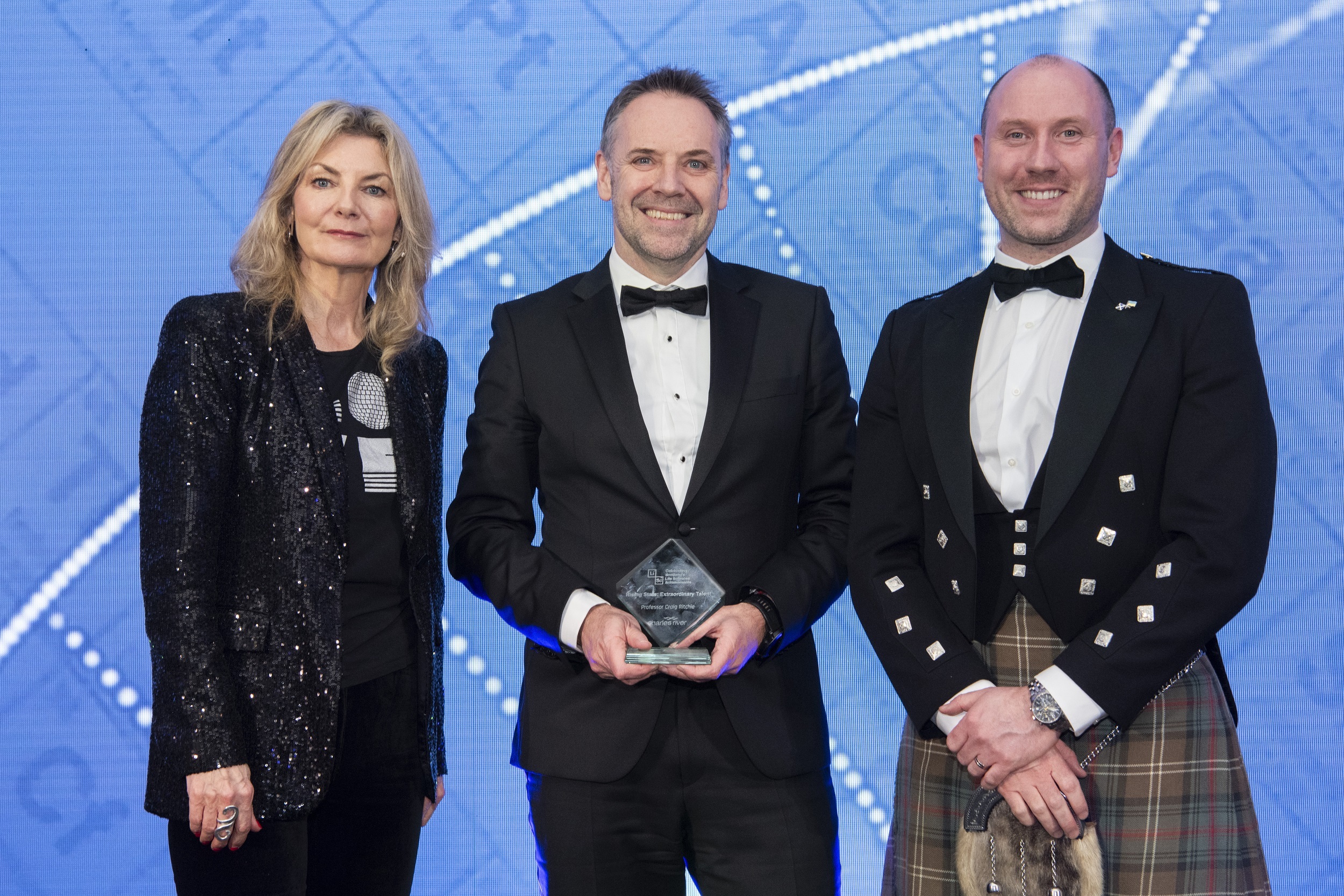 Professor Craig Ritchie (centre) with host Jo Caulfield (left) and Cab Sec Neil Gray (right)