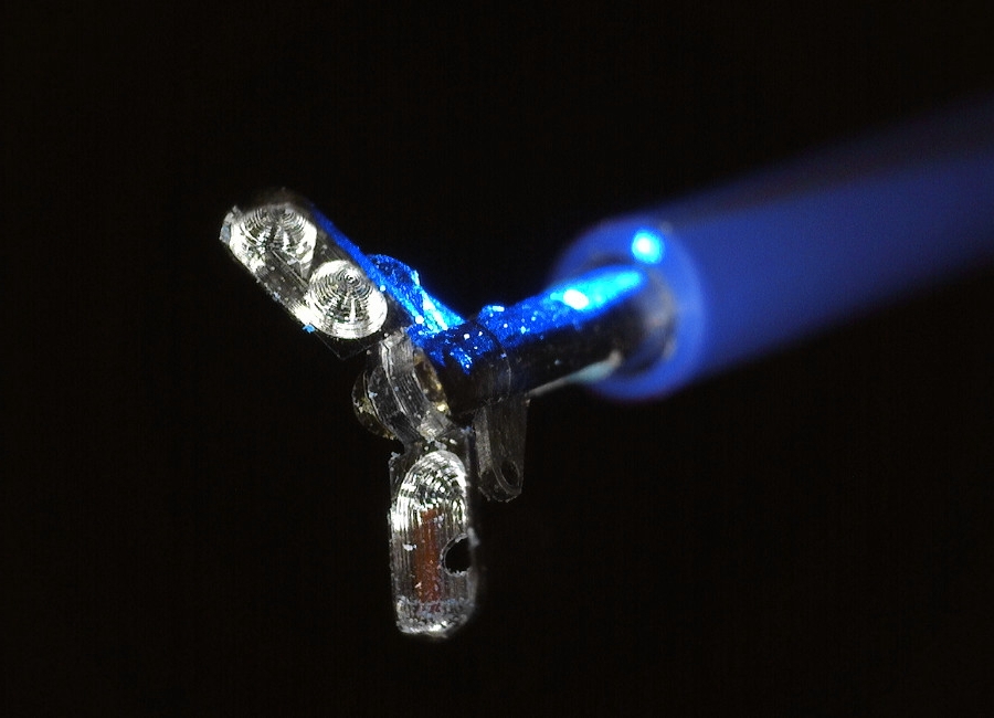 One millimetre diameter biopsy forceps protruding from the Prothea micro-endoscope