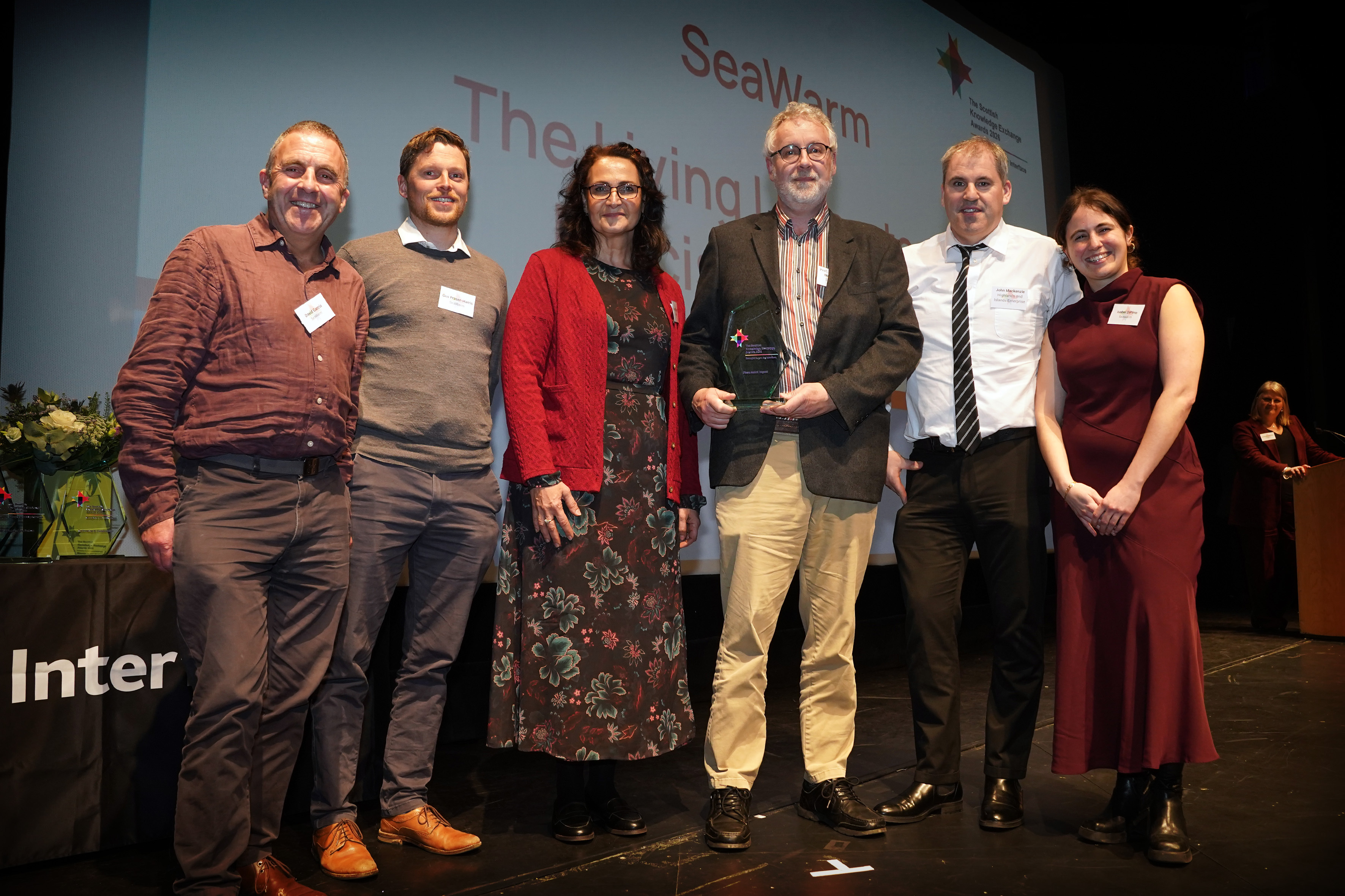 The SeaWarm team: Dr Gus Fraser-Harris (2nd from left), Professor Chris McDermott (4th from left) with John MacKenzie of Highlands and Islands Enterprise